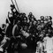 Abraham Gafni (Bildmitte mit halb verdecktem Gesicht in der dritten Reihe oberhalb des Jungen mit Mütze und in Lederhose) an Bord des illegalen Flüchtlingsschiffes „Liesel“ auf dem Weg von Rumänien nach Haifa 1939, (Bildquelle: Abraham Gafni)